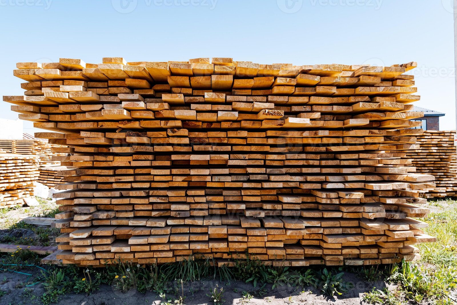 Stacked lumber planks at a lumber yard